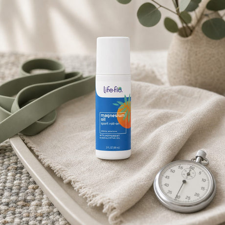 Life-flo Magnesium Oil Sport Roll-On applied to a woman’s calf after exercise