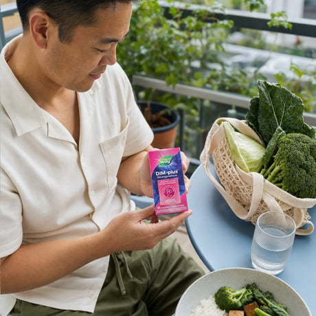 Nature's Way DIM-Plus lifestyle scene with supplement bottle and capsules