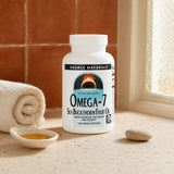 Woman adding Source Naturals Omega-7 Sea Buckthorn Fruit Oil to a daily supplement routine