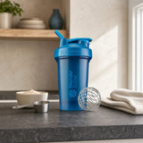 BlenderBottle Classic V2 Ocean Blue 20 oz shaker bottle front view with BlenderBall wire whisk