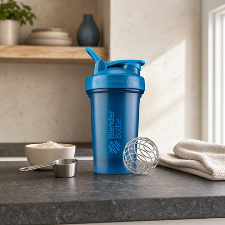BlenderBottle Classic V2 Ocean Blue 20 oz shaker bottle front view with BlenderBall wire whisk