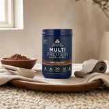 Ancient Nutrition Multi Protein Powder Milk Chocolate tub beside a chocolate shake