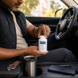 Pure Encapsulations DHEA 5 mg bottle on a kitchen table with breakfast and a notebook