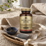 Solgar Super GLA 300mg bottle with amber softgels on a clean counter
