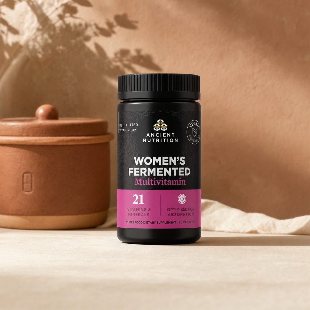 Ancient Nutrition Women’s Fermented Multi bottle with capsules and whole food nutrient graphics