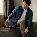 Man using Ancient Nutrition Men's Fermented Multi capsules as part of a morning routine