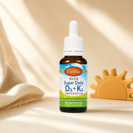 Mother adding Carlson Kid's Super Daily D3 + K2 drops to a child's breakfast drink