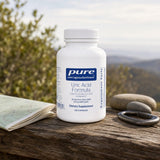 Pure Encapsulations Uric Acid Formula 120 capsules bottle on a neutral countertop