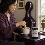 Ancient Nutrition Active Peptides Magnesium Powder Lavender Honey lifestyle display with a warm beverage