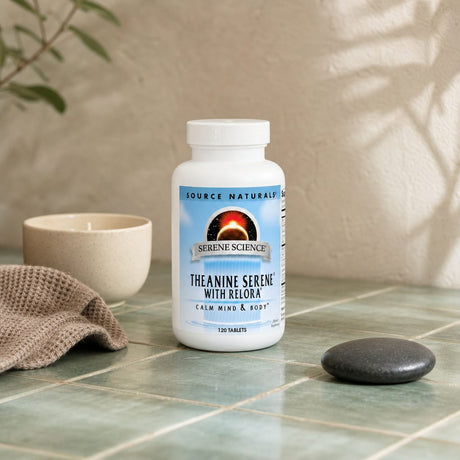 Source Naturals Theanine Serene with Relora bottle beside a mug in a calm desk setting
