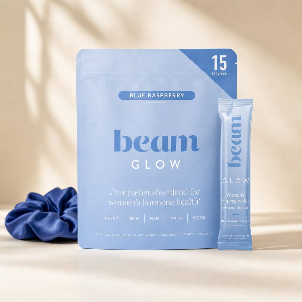Beam Glow Blue Raspberry box and individual powder stick beside a prepared blue drink