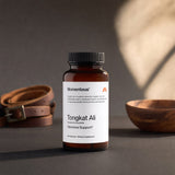 Momentous Tongkat Ali Capsules bottle in a daily wellness routine with capsules nearby