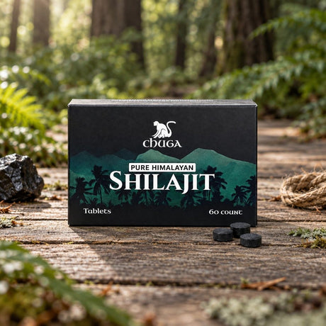 Chuga Pure Himalayan Shilajit Tablets box and three tablets on a wooden forest boardwalk