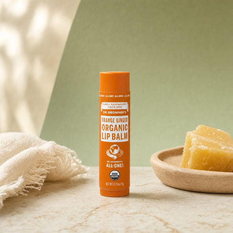 Dr. Bronner's Organic Lip Balm Orange Ginger tube with orange label details