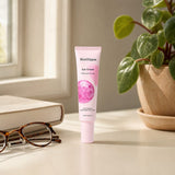 Mad Hippie Eye Cream tube with product texture on a soft pastel background