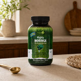 Irwin Naturals Mighty Moringa bottle with liquid softgels arranged beside it