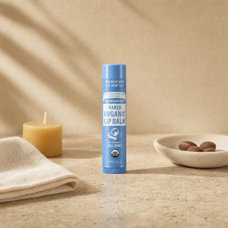 Dr. Bronner's Organic Lip Balm Naked tube with cap removed showing balm stick