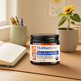 Motherlove Everyday Baby Balm jar with sunflower, chamomile, calendula, and marshmallow botanicals