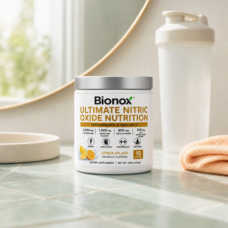 Bionox CardioGO Citrus Splash powder mixed in a glass with orange and grapefruit nearby