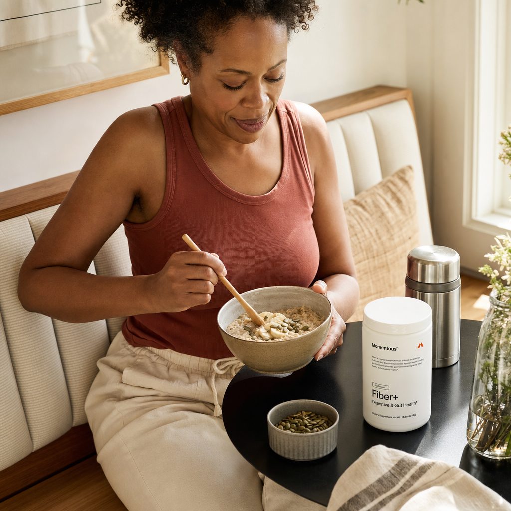 Momentous Fiber+ Powder Unflavored scoop and powder shown with a daily shake