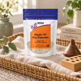 NOW Foods Single "0" Empty Veg Capsules pouch in a wicker tray with wooden capsule-filling tools