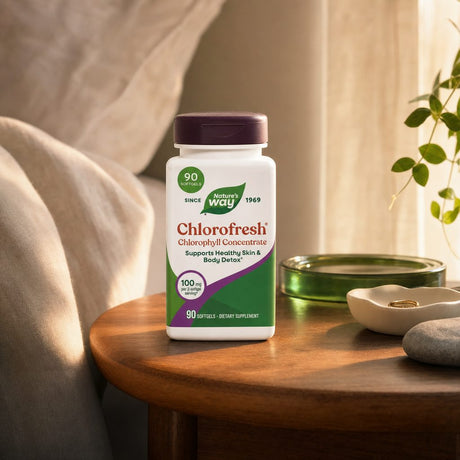 Nature's Way Chlorofresh Chlorophyll Concentrate 90 softgels with water on a bright counter