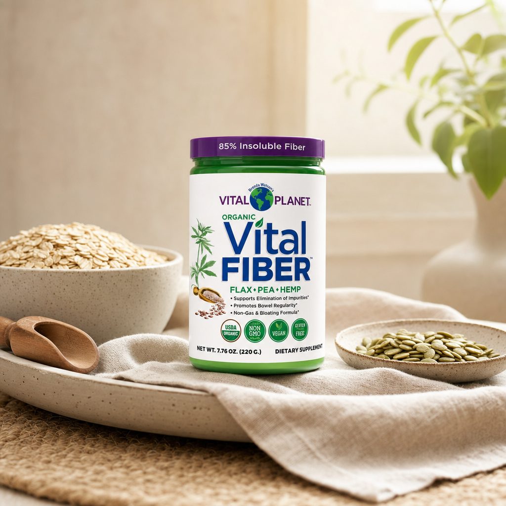 Woman adding Vital Planet Organic Vital Fiber to a smoothie in a kitchen