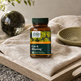 Gaia Herbs Gas & Bloating bottle and capsules displayed in a bright kitchen setting