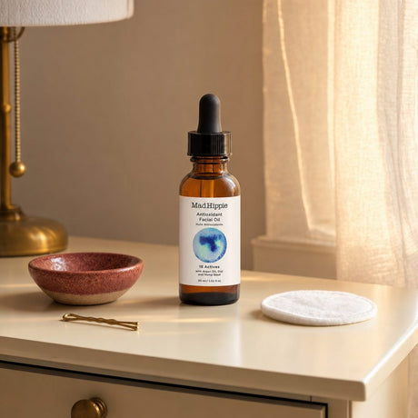 Mad Hippie Antioxidant Facial Oil bottle and carton displayed on a blue background