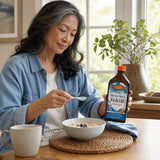 Carlson The Very Finest Fish Oil Orange bottle and liquid serving details