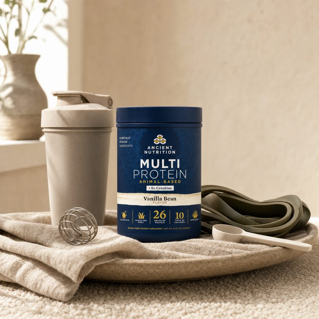 Ancient Nutrition Multi powder scoop beside shaker bottle