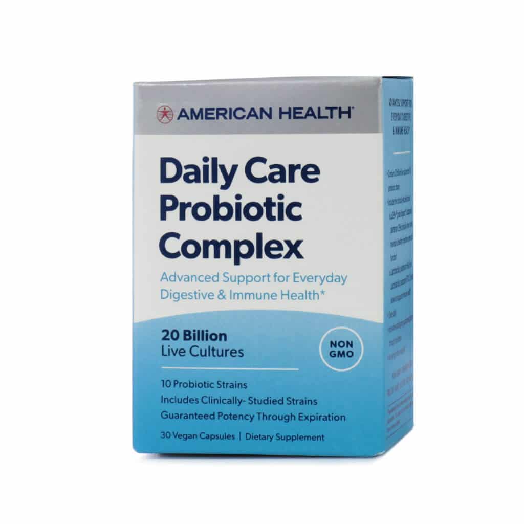 A box of American Health Daily Care Probiotic Complex, featuring 20 billion live cultures and 10 probiotic strains for digestive and immune health. The packaging has a white and blue gradient design, with 'NON-GMO' and 'Guaranteed Potency Through Expiration' displayed. Contains 30 vegan capsules.