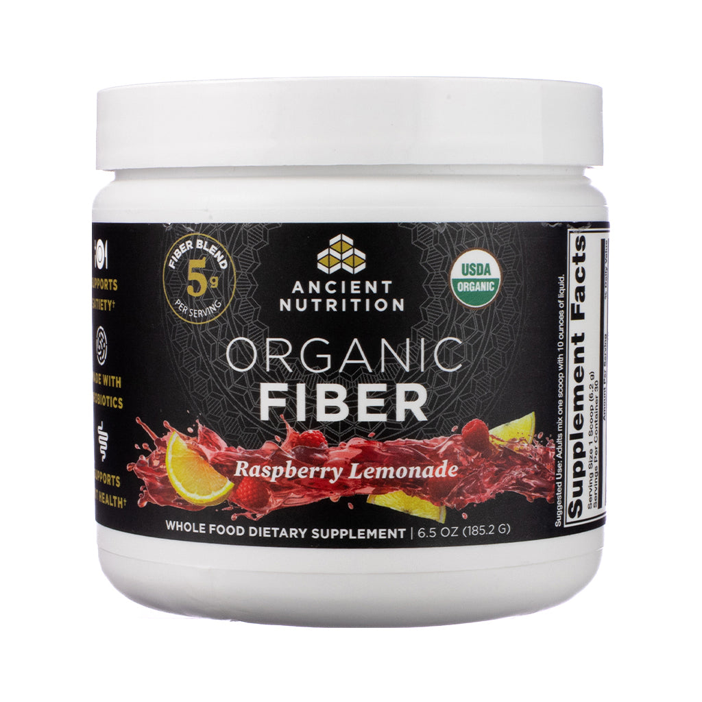 Vibrant front-facing label of Ancient Nutrition Organic Fiber Powder in Raspberry Lemonade flavor, featuring pink and yellow accents, fruit illustrations, and USDA Organic seal emphasizing digestive health support.

