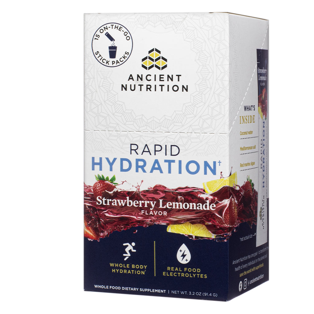 The front label of Ancient Nutrition Rapid Hydration Strawberry Lemonade 3.2 oz Stick Packs features flavor imagery with splashing strawberries and lemon slices, and highlights benefits like whole body hydration and real food electrolytes.