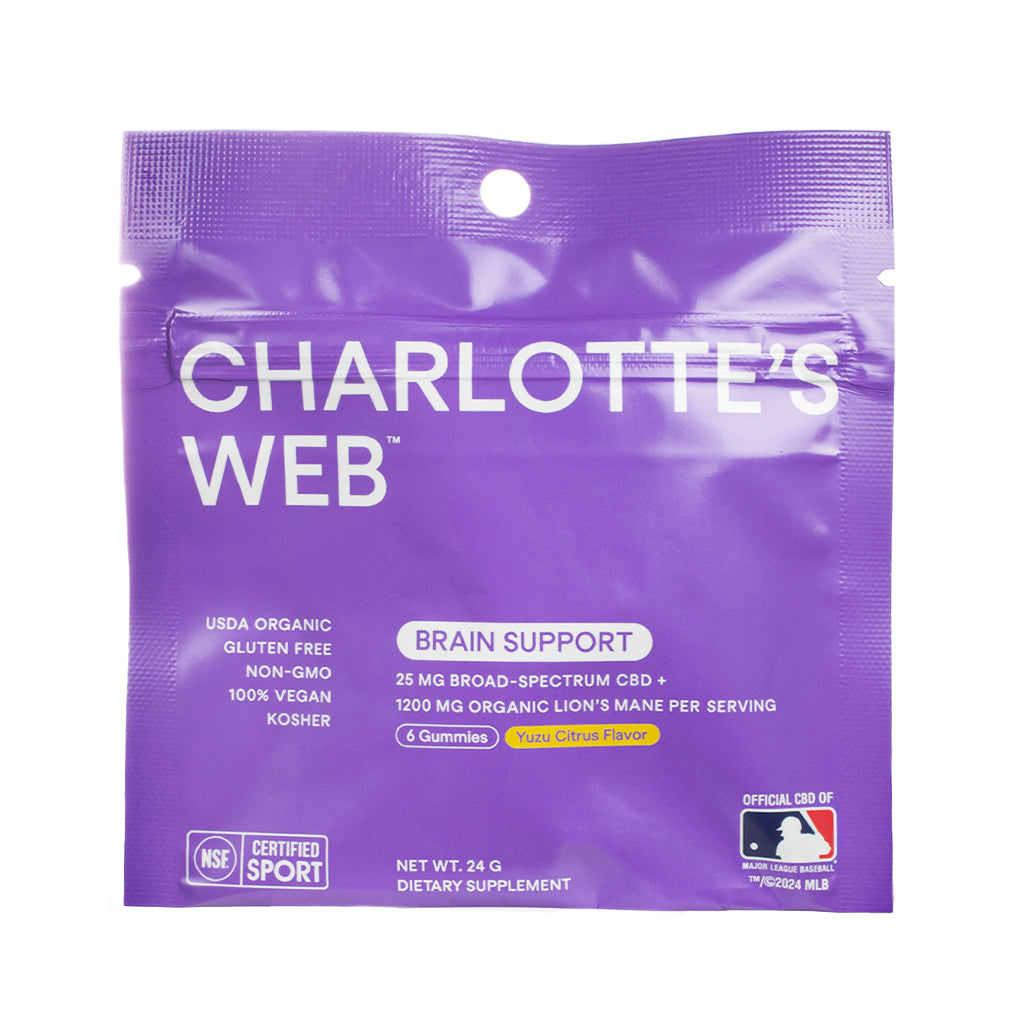 Purple pouch of Charlotte’s Web Brain Support CBD Gummies featuring 6 gummies with 25 mg broad-spectrum CBD and 1200 mg organic Lion’s Mane per serving in Yuzu Citrus Flavor, labeled USDA Organic and NSF Certified Sport.
