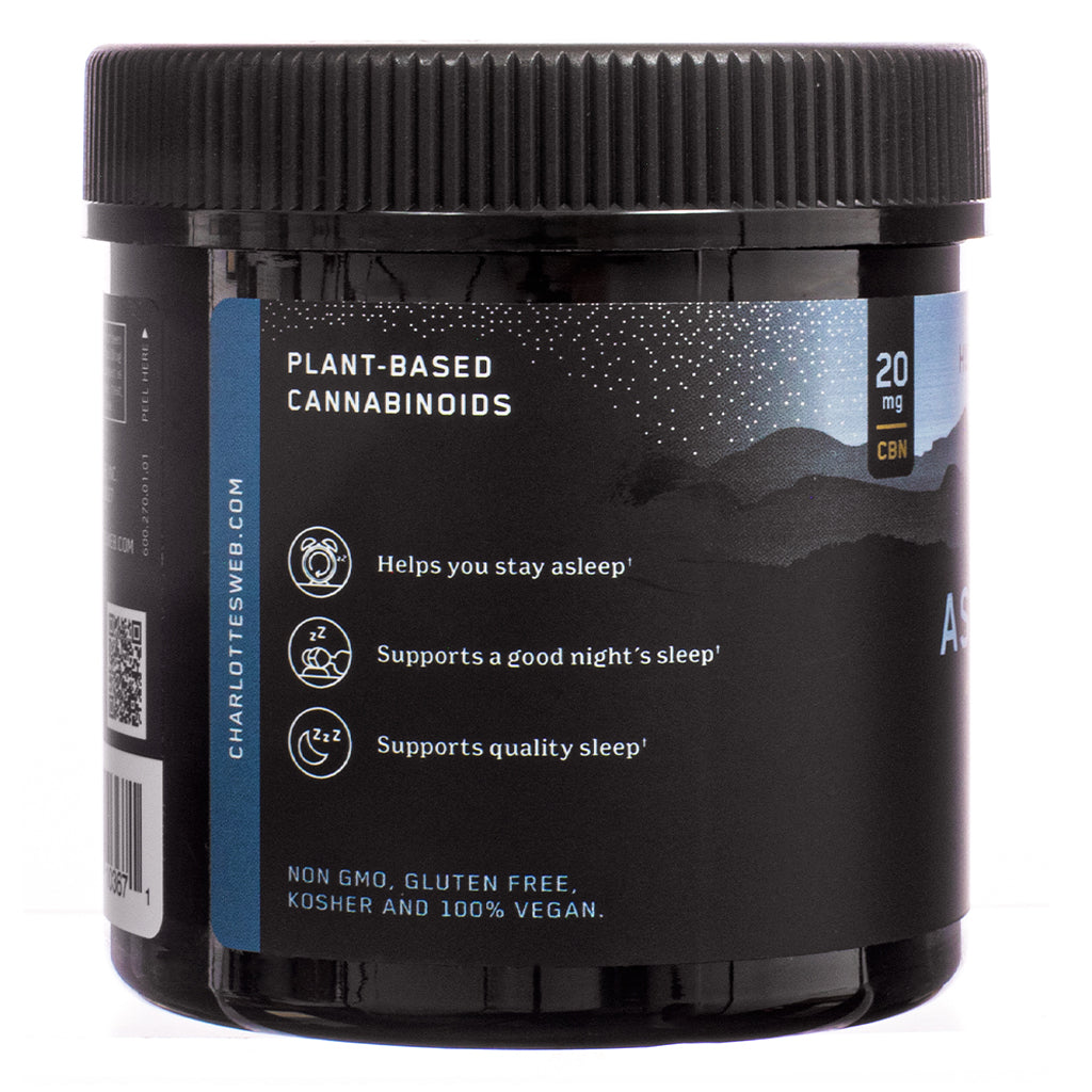 The side label of Charlotte's Web Stay Asleep Gummies, 30-count, Huckleberry flavor, displaying key product benefits. White text on a dark blue background highlights claims such as "helps you stay asleep" and "supports quality sleep." Icons emphasize the product’s non-GMO, gluten-free, kosher, and 100% vegan certifications.