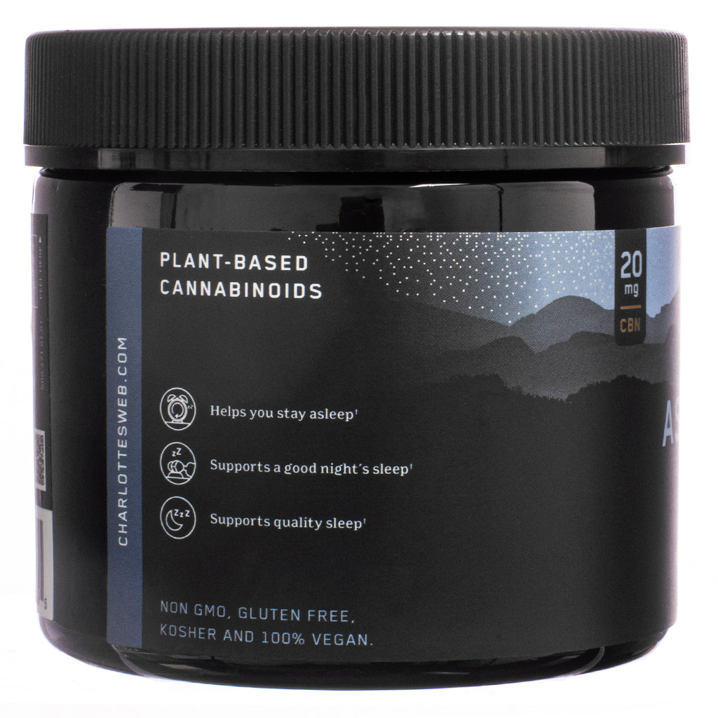 The side label of Charlotte's Web Stay Asleep Gummies, 60-count, Huckleberry flavor, displaying key product benefits. White text on a dark blue background highlights claims such as "helps you stay asleep" and "supports quality sleep." Icons emphasize the product’s certifications, including non-GMO, gluten-free, kosher, and 100% vegan.