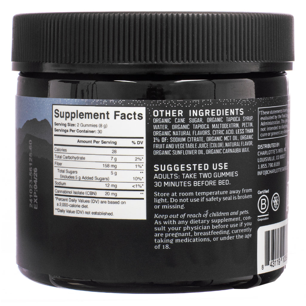 A black jar of Charlotte's Web Stay Asleep Gummies, 60-count, Huckleberry flavor, featuring a close-up of the supplement facts panel. The label details nutritional information, including 20 mg of CBN per serving, total carbohydrates, sugars, and ingredients such as organic cane sugar and tapioca syrup. Suggested use recommends taking two gummies before bed for sleep support.