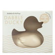 Box packaging of Dabble & Dollop Dabble Ducky Bath Toy & Teether. Hypoallergenic and latex-free, designed for teething relief and bath time fun, suitable for infants.