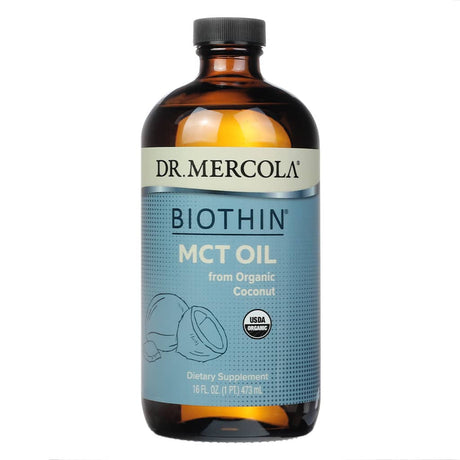 A dark amber glass bottle of Dr. Mercola Biothin MCT Oil, sourced from organic coconut, USDA-certified organic, and containing 16 fl oz of dietary supplement.