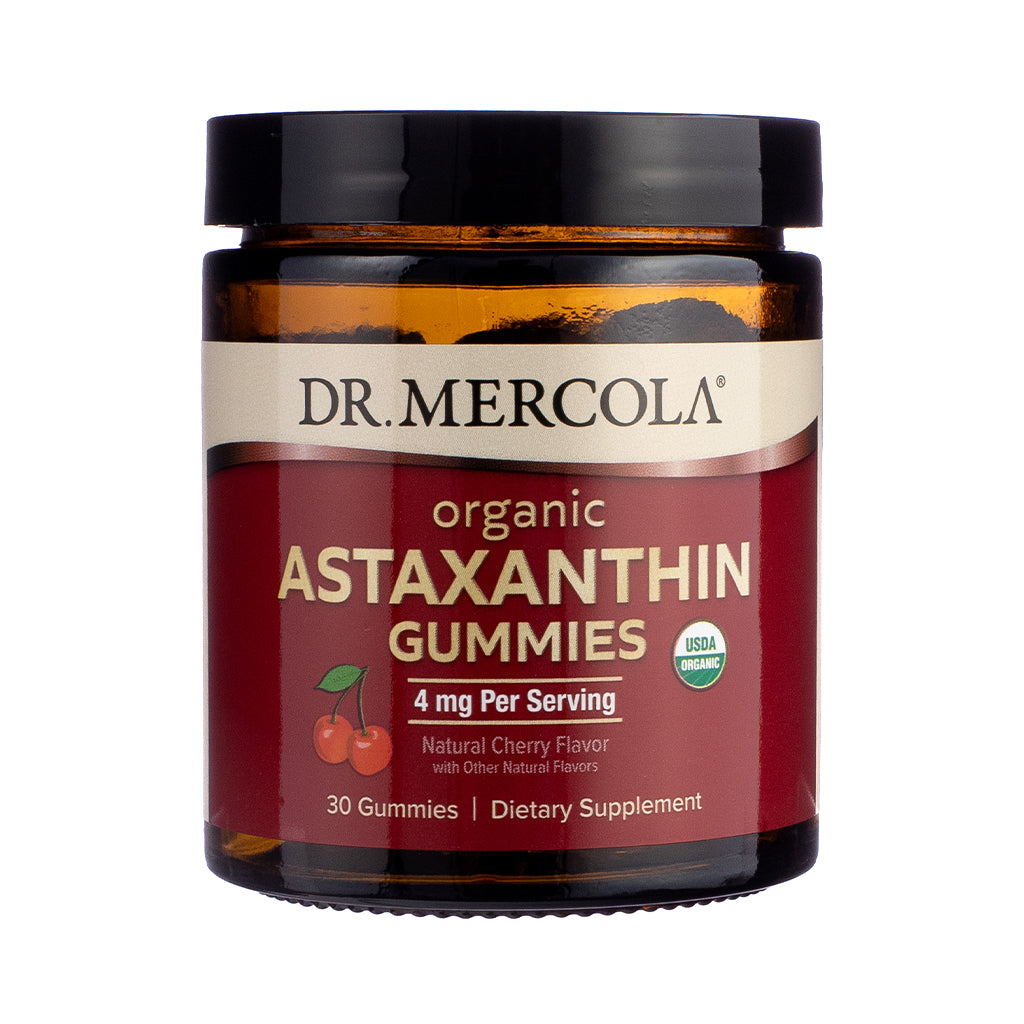 Front label of Dr. Mercola Organic Astaxanthin Gummies in Cherry flavor, featuring red accents, organic certification, and antioxidant support claims in a resealable pouch design.

