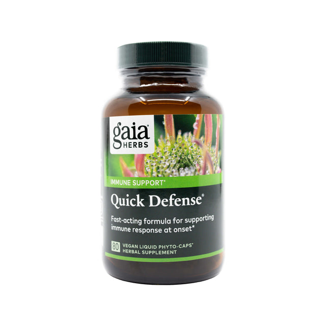 Amber glass bottle of Gaia Herbs Quick Defense, labeled for immune support with a fast-acting formula. The product contains 80 vegan liquid phyto-caps made with echinacea, elderberry, ginger, and andrographis for immune response at onset.