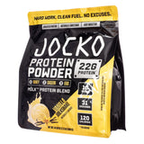 A 2.1 lbs / 961 g / 31 servings bag of Jocko Mölk Protein Powder in Vanilla Milkshake flavor, showcasing 22 grams of protein per serving, a blend of whey, casein, and egg protein, with 1 gram of sugar, 31 servings, and 120 calories per serving.