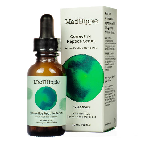 A 1.02 fl oz / 30 ml bottle of Mad Hippie Corrective Peptide Serum with a dropper, displayed beside its box featuring a green watercolor design. The product highlights 17 actives, including Matrixyl, Uplevity, and PoreTect, targeting wrinkles, firmness, and skin texture.