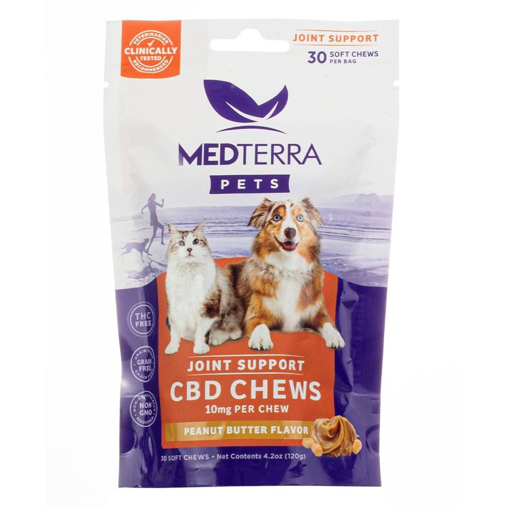 Package of Medterra Pets Calming CBD Chews featuring a photo of a gray cat and a fluffy brown-and-white dog. The label indicates 10mg of CBD per chew, 300mg per bag, and a bacon flavor, with 30 soft chews total. Packaging highlights include THC-free, grain-free, non-GMO, and veterinarian recommended.