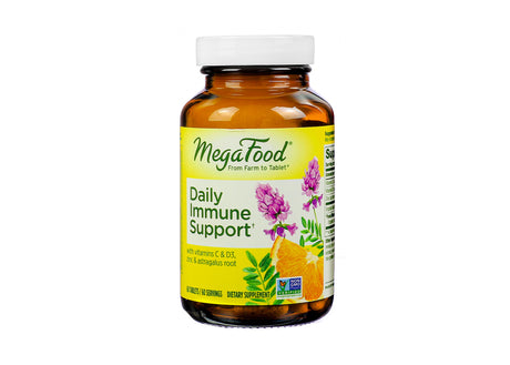 Amber glass bottle of MegaFood Daily Immune Support tablets with a yellow label displaying botanical illustrations of astragalus root, citrus, and herbs. Promotes immune health with vitamins C & D3, zinc, and astragalus root; includes 60 tablets (60 servings), and features the Non-GMO Project Verified seal.