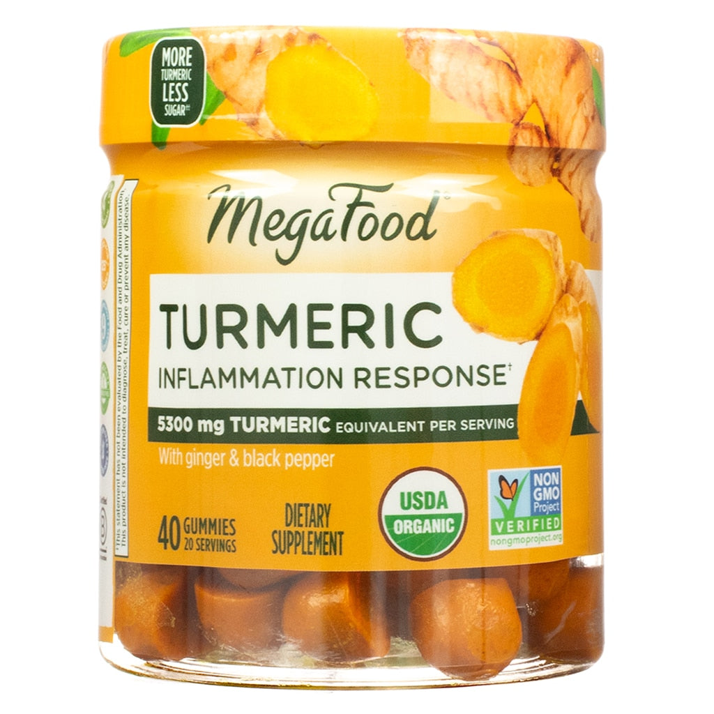 Front label of a jar of MegaFood Turmeric Inflammation Response gummies, featuring bold text stating “5300 mg Turmeric equivalent per serving” and “With ginger & black pepper.” The jar contains 40 gummies (20 servings) and includes USDA Organic and Non-GMO Project Verified seals, with images of turmeric roots and slices on the label. Text on the lid reads “More Turmeric Less Sugar.”