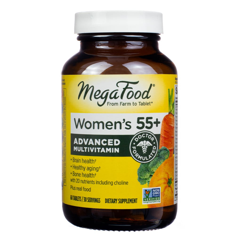 MegaFood Women's 55+ Advanced Multivitamin, a dietary supplement containing 60 tablets. The amber bottle highlights brain, bone, and heart health benefits, made with real food and featuring a 'Doctor Formulated' seal.