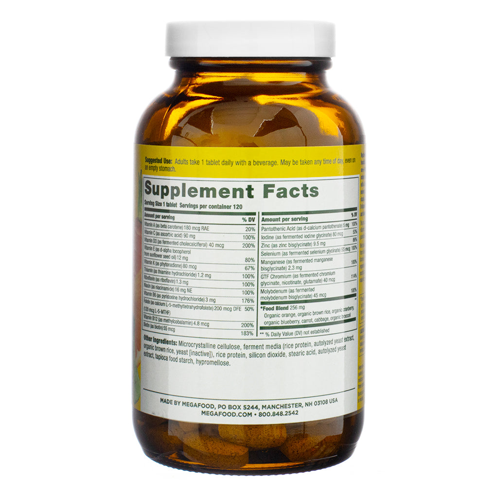 The supplement facts panel of MegaFood Women's 55+ One Daily Multivitamin, 120 Tablets, listing essential vitamins, minerals, and food-based ingredients. The label details a serving size of one tablet, with key nutrients like vitamin D, B vitamins, zinc, iodine, and a food blend containing organic orange, cranberry, and carrot extracts. The product is made with whole food ingredients and is free from common allergens.
