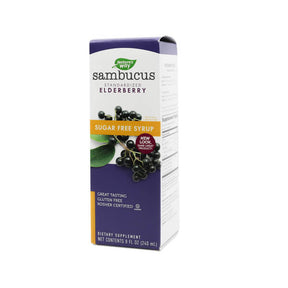 Box of Nature’s Way Sambucus Sugar Free Syrup, a dietary supplement made with standardized elderberry. The front of the box displays dark elderberries on a branch, a “Sugar Free Syrup” orange banner, and text highlighting it as gluten-free, kosher certified, and great tasting. The label also features a red badge that reads “New Look, Same Product.” 8 fluid ounces
